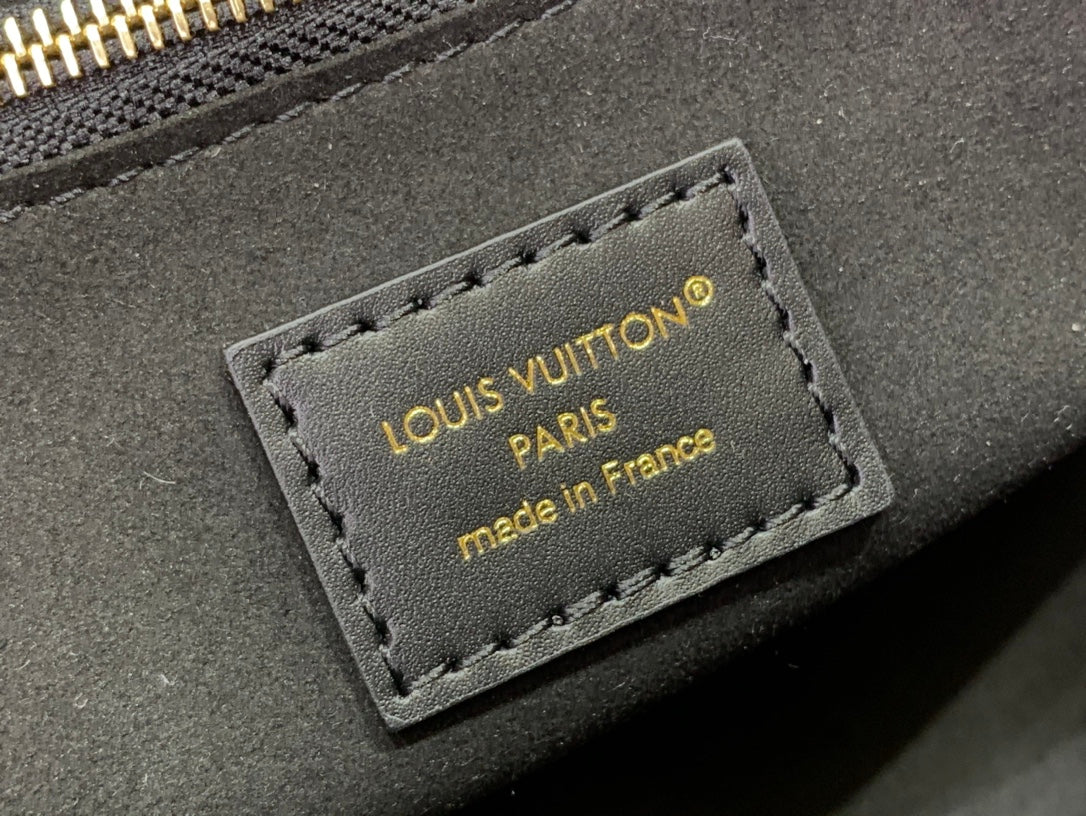 Louis Vuitton monogram bag leather label with 'Made in France' stitching
