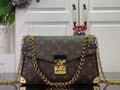 Louis Vuitton monogram bag with gold chain strap and front flap closure