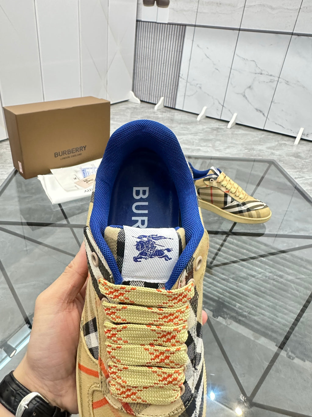 Heel view check low-top sneaker with blue collar and Burberry logo patch, tan sole