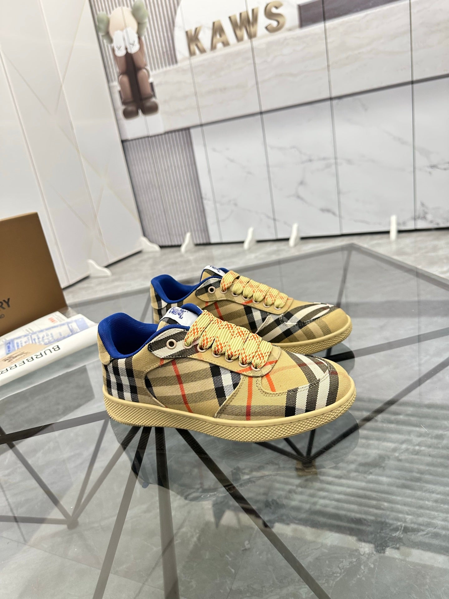 Check low-top sneaker with blue trim, lace-up front, tan ridged outsole