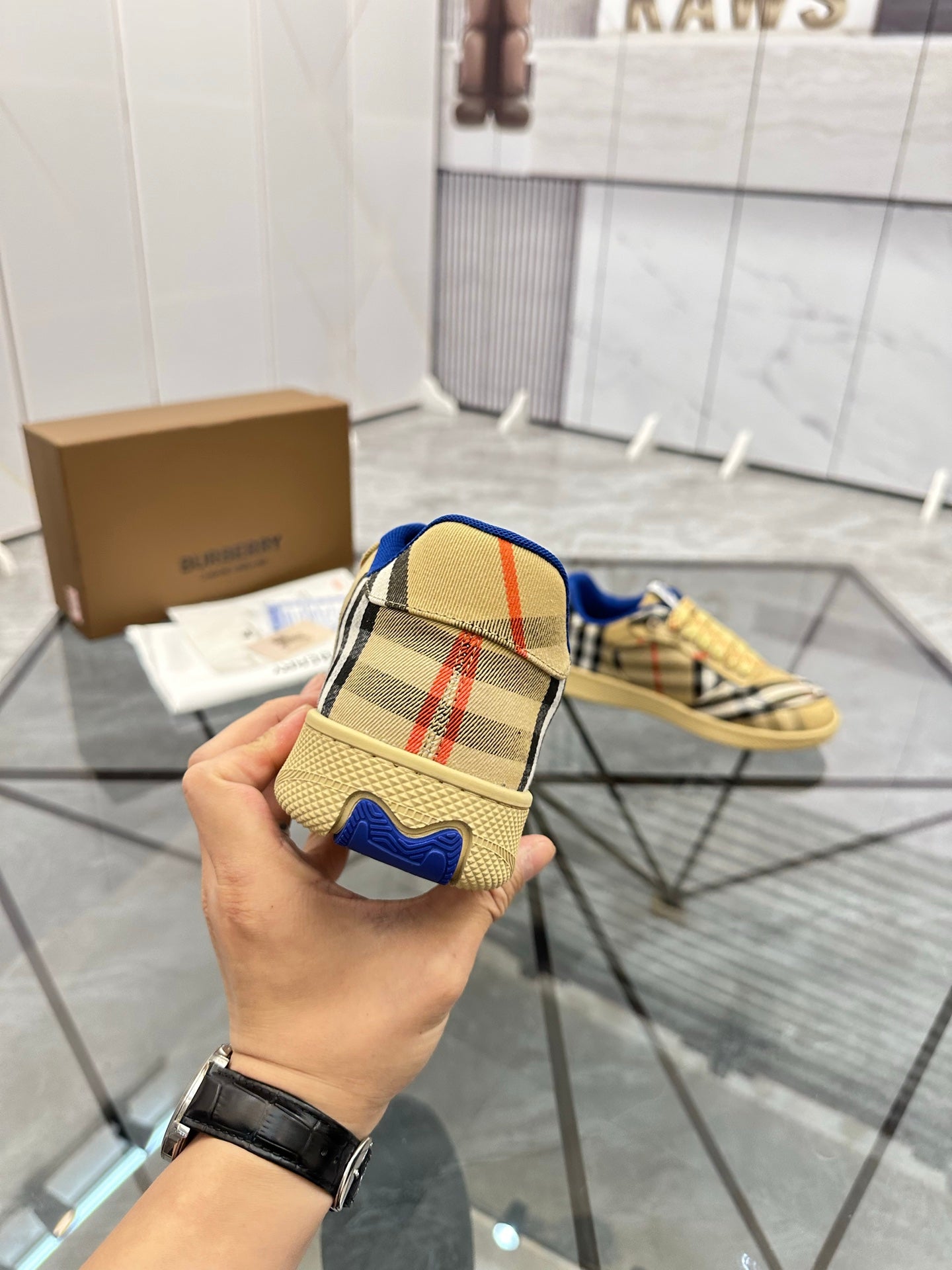 Back view check low-top sneaker with blue heel and tan sole, lace-up front