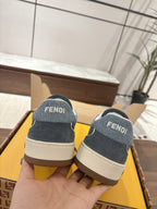 Back view of dark blue Fendi sneakers with FENDI patch and beige outsole