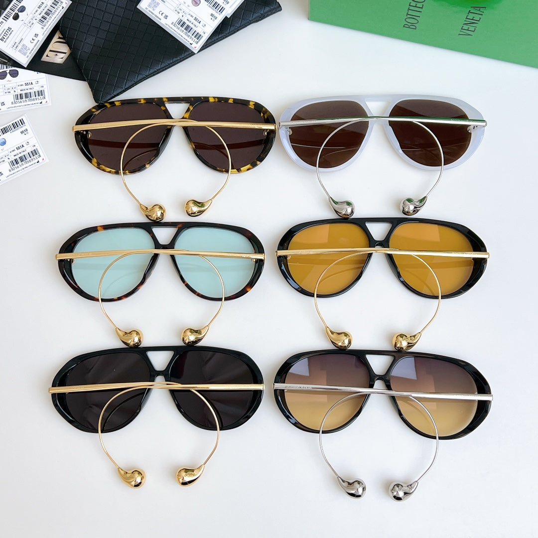 Assorted sunglasses collection with gold-toned frames and tinted lenses, 6 pairs.
