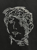 Off-White T-shirt close-up of white line-art head and shoulder graphic
