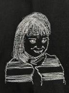 Off-White T-shirt close-up of white line-art face graphic
