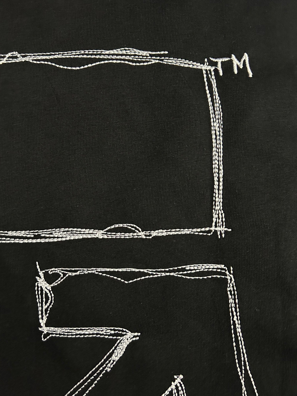 Off-White T-shirt back close-up with white square outline and lines