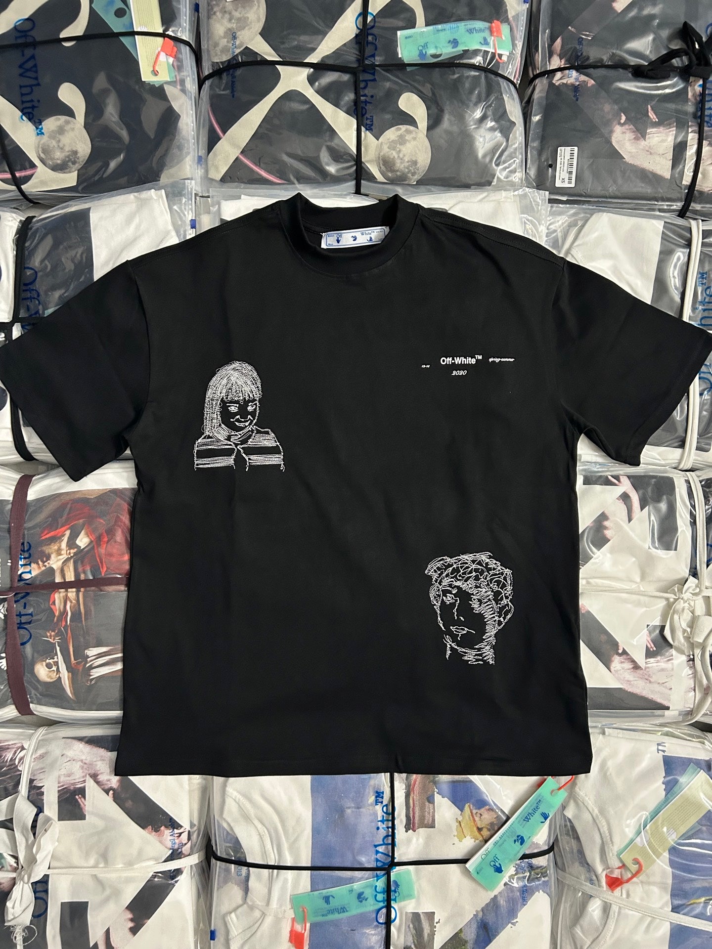 Off-White T-shirt with black base and white face graphic on front