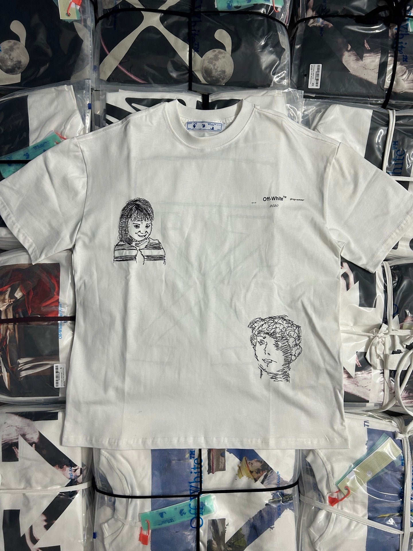 Off-White off-white T-shirt with two black line-art portrait graphics on front