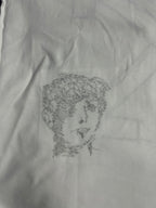 Off-White off-white T-shirt with small black line-art face portrait graphic