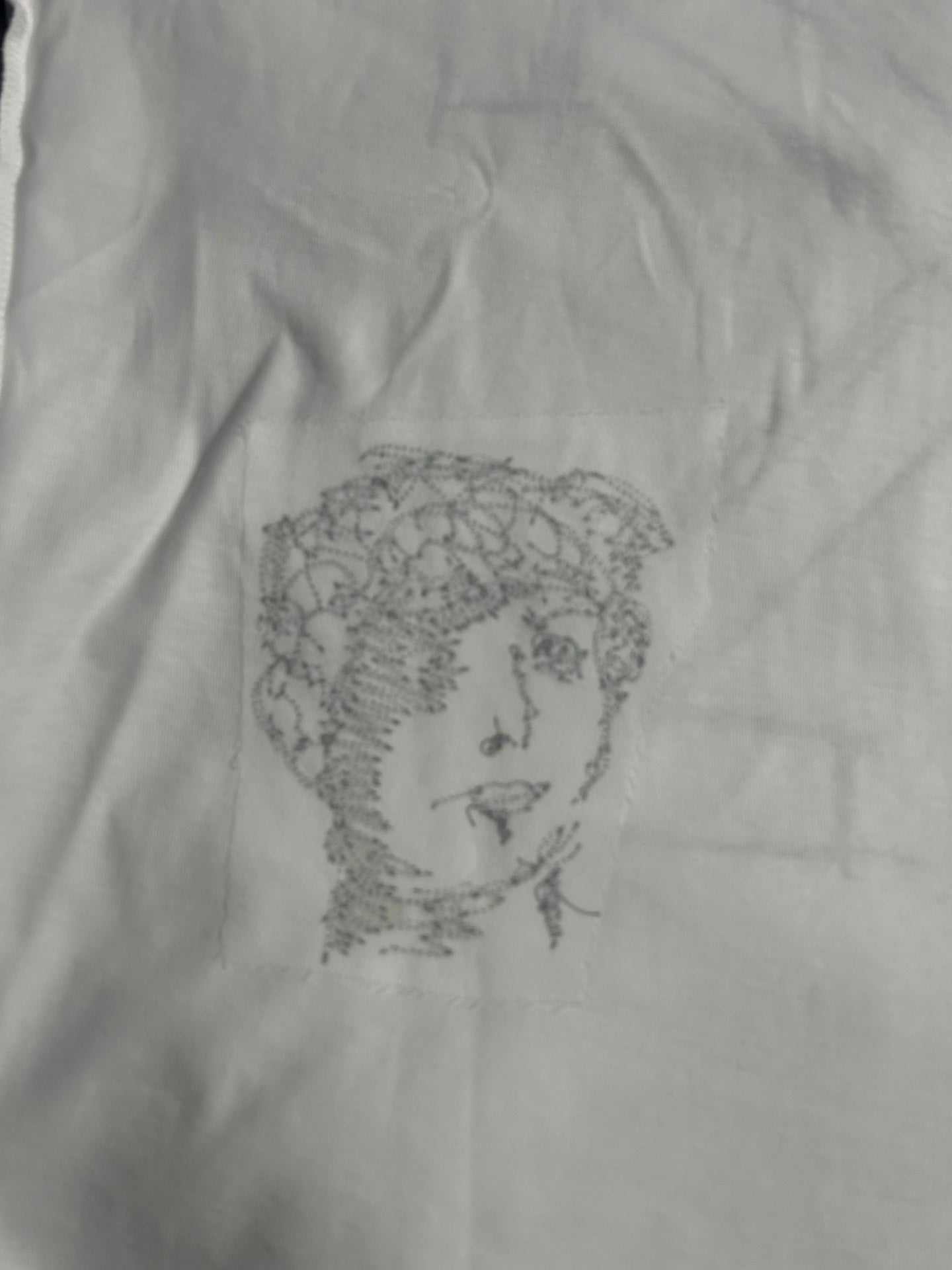 Off-White off-white T-shirt close-up of small black line-art face print