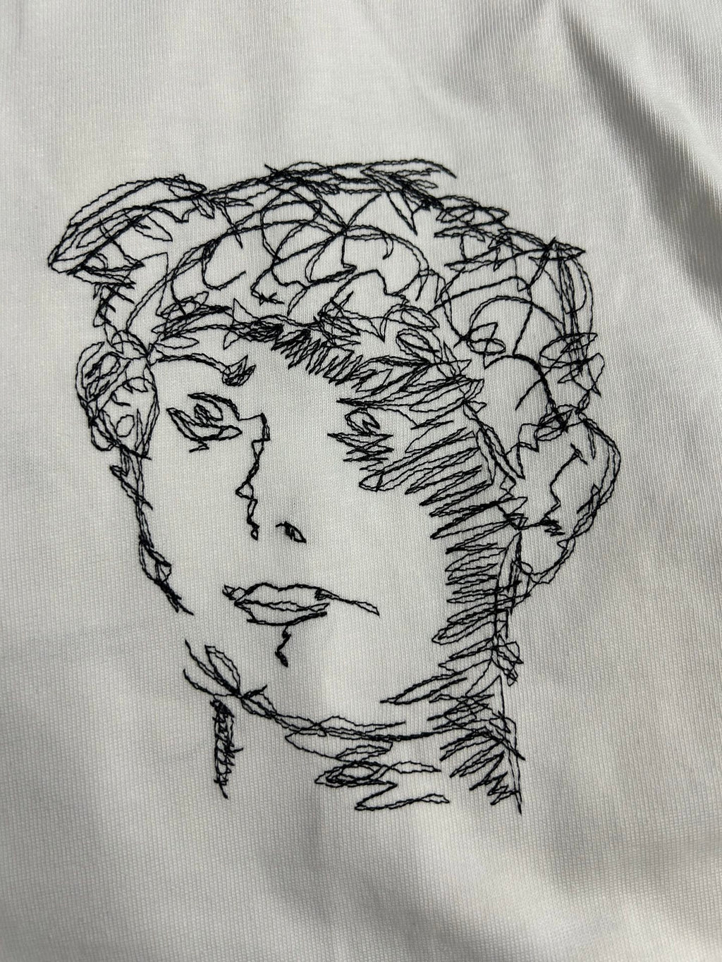 Off-White off-white T-shirt with black line-art profile face graphic