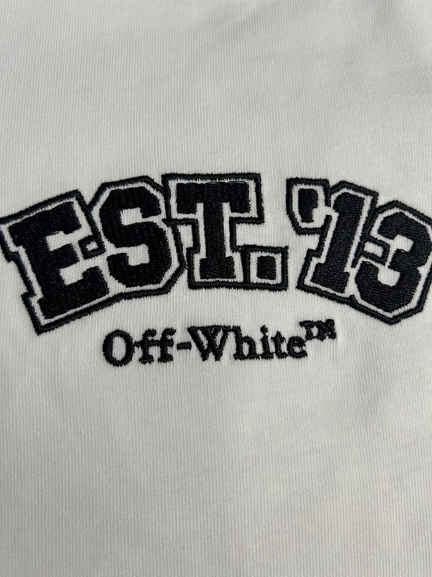 Off-White EST. 1973 and Off-White text logo print