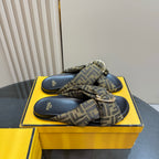 Fendi ladies slide sandals featuring FF jacquard cross bow strap over navy footbeds