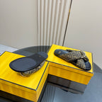Fendi ladies slide sandals showing navy outsole and FF strap detail