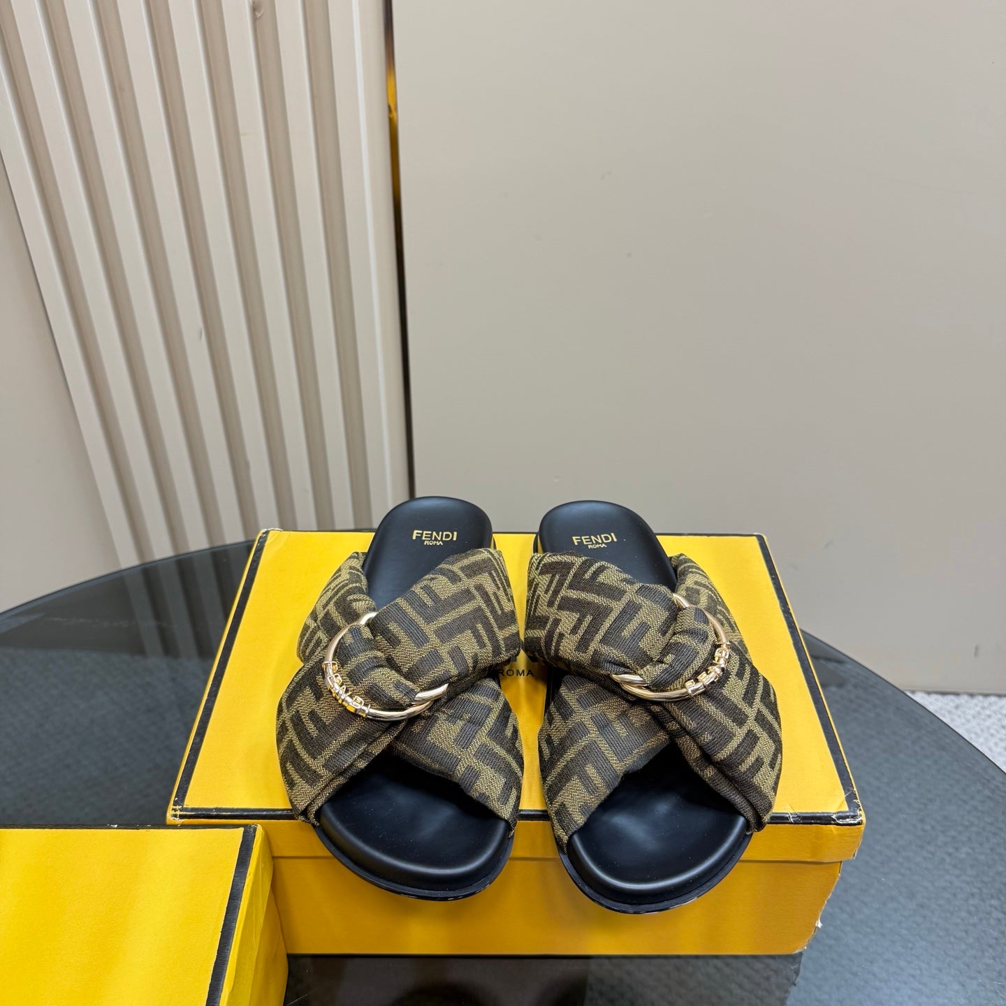 Pair of Fendi ladies slide sandals with FF patterned bow straps and navy soles