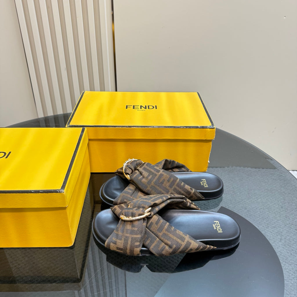 Fendi ladies slide sandals with FF monogram strap and metal buckle detail