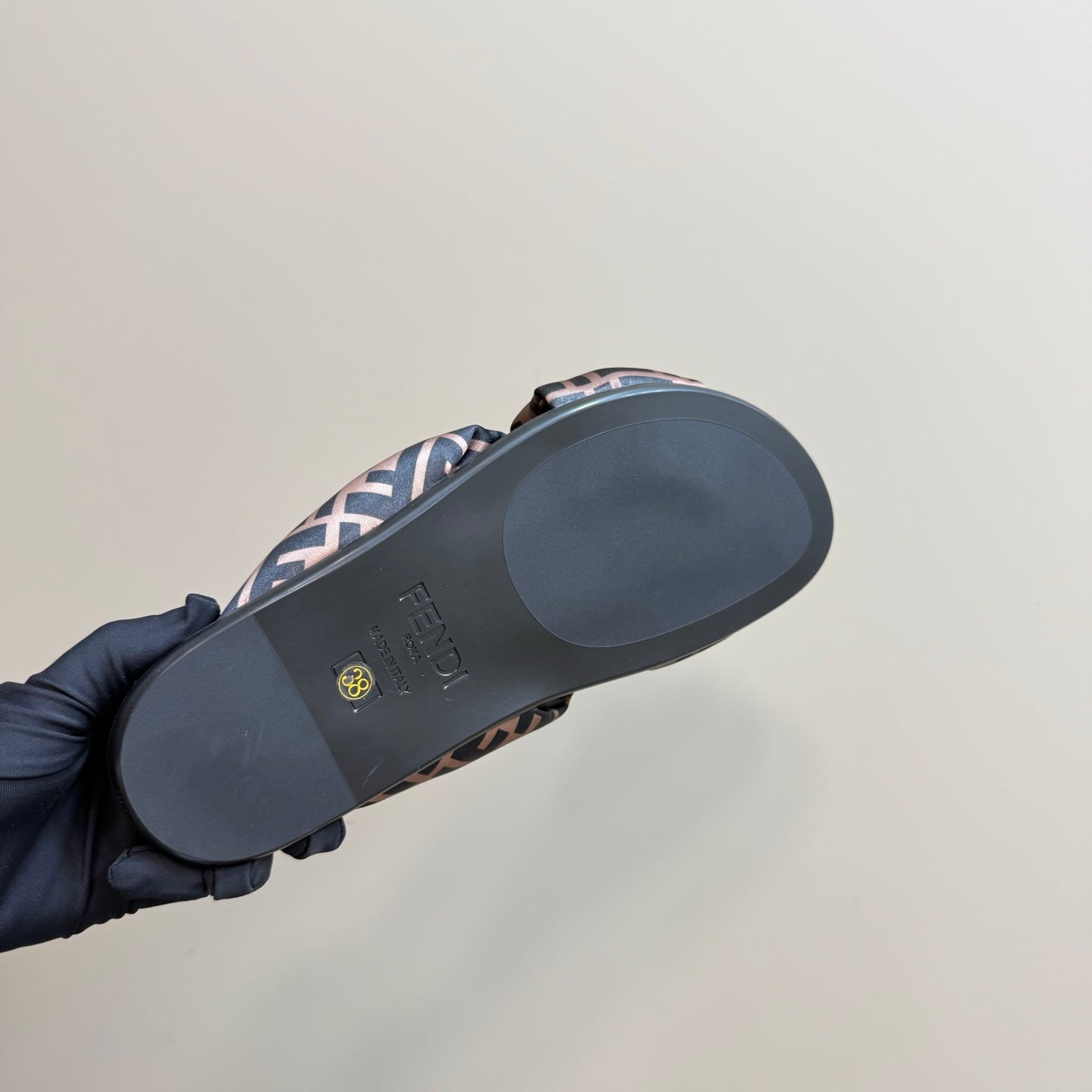 Fendi slide sandal outsole, dark rubber sole with FF logo strap