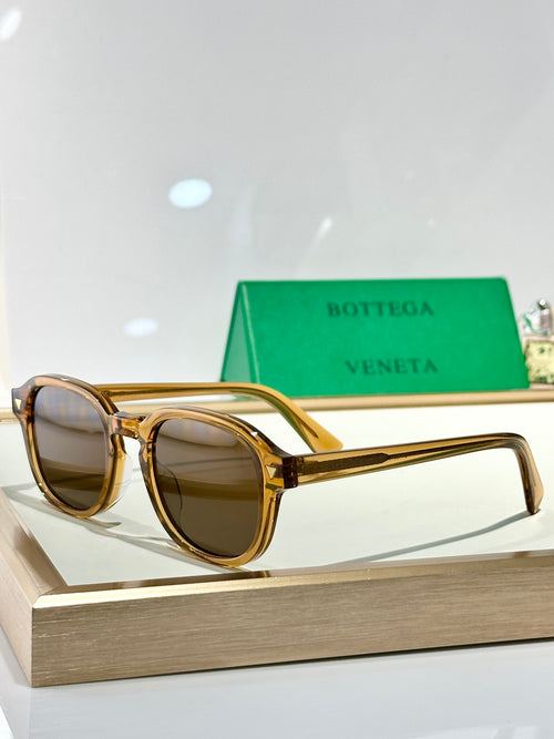 Bottega Veneta glasses with gold-tone frame and brown tinted lenses