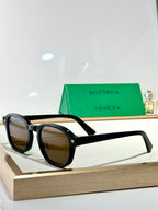 Bottega Veneta glasses with black frame and brown tinted lenses