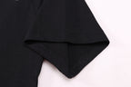 Black T-shirt hem and sleeve edge close-up