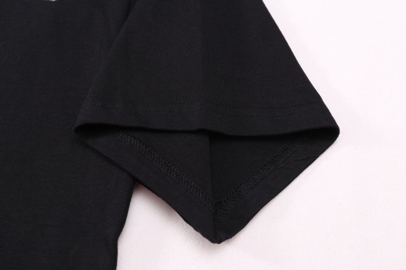 Black T-shirt hem and sleeve edge close-up