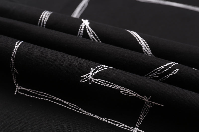 Off White black clothing fabric with white plaid stitching