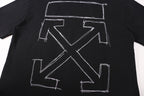 Black T-shirt back graphic close-up with outlined square and X shapes