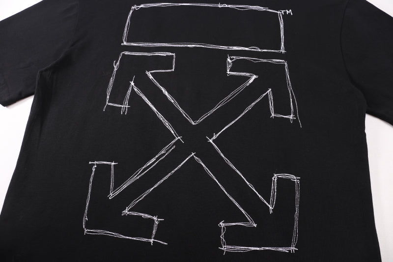 Black T-shirt back graphic close-up with outlined square and X shapes