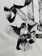White T-shirt featuring a close-up black bird graphic