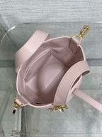 Pink Dior handbag interior with adjustable shoulder strap and gold-tone hook