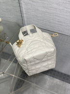Dior quilted mini tote bag with top handle, white leather, gold charm detail