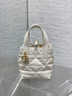 Dior quilted mini tote bag with front emblem, top handle, white leather, gold hardware