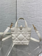 Dior quilted tote bag with dual straps, front buckle, white leather, gold hardware