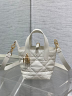 Dior quilted tote bag with top handle and shoulder strap, gold hardware, white leather
