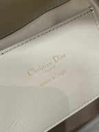 Dior bag interior label reading Christian Dior Paris, Made in Italy