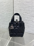 Black quilted mini handbag with top handle and front clasp