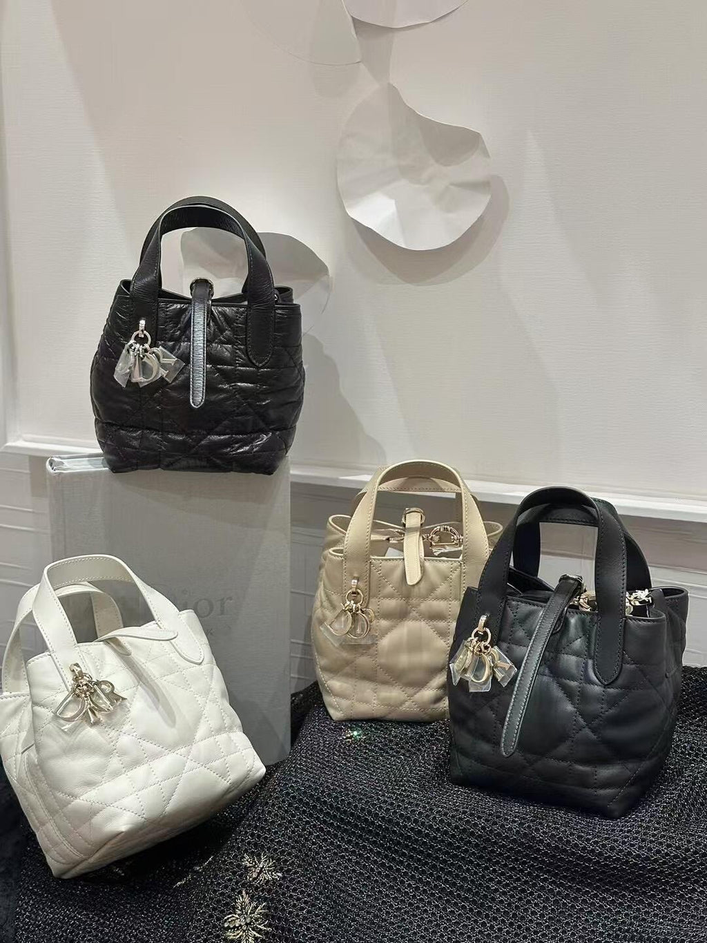 Dior bag mini totes collection: black, beige, and white quilted styles with charms