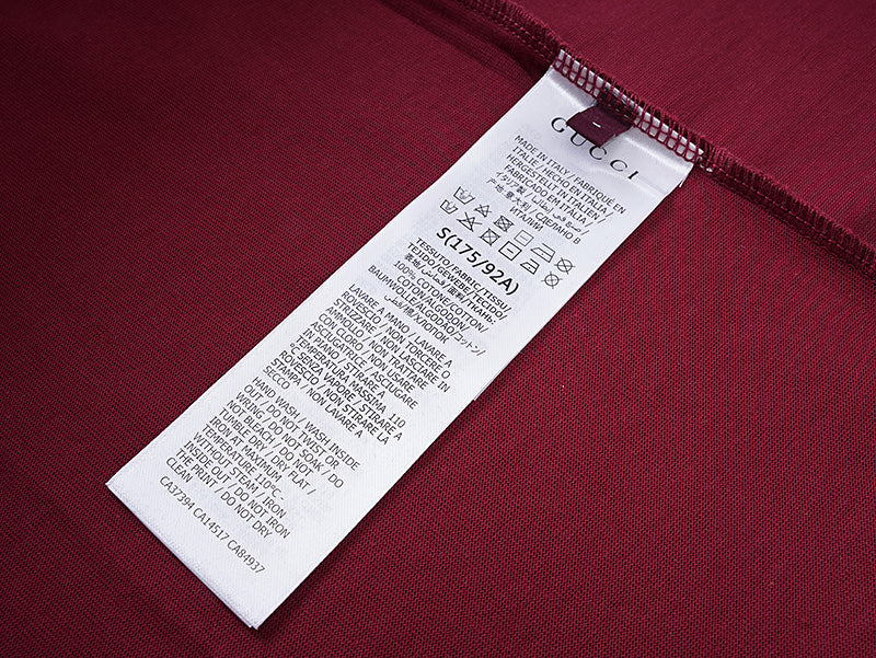 Burgundy Gucci T-shirt with care label and hang tag