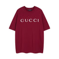 Burgundy Gucci T-shirt with large white GUCCI logo on front