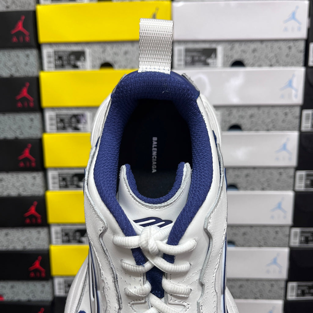 White and blue lace-up sneaker, heel and collar view