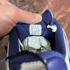 Balenciaga label on blue sneaker interior with white tissue