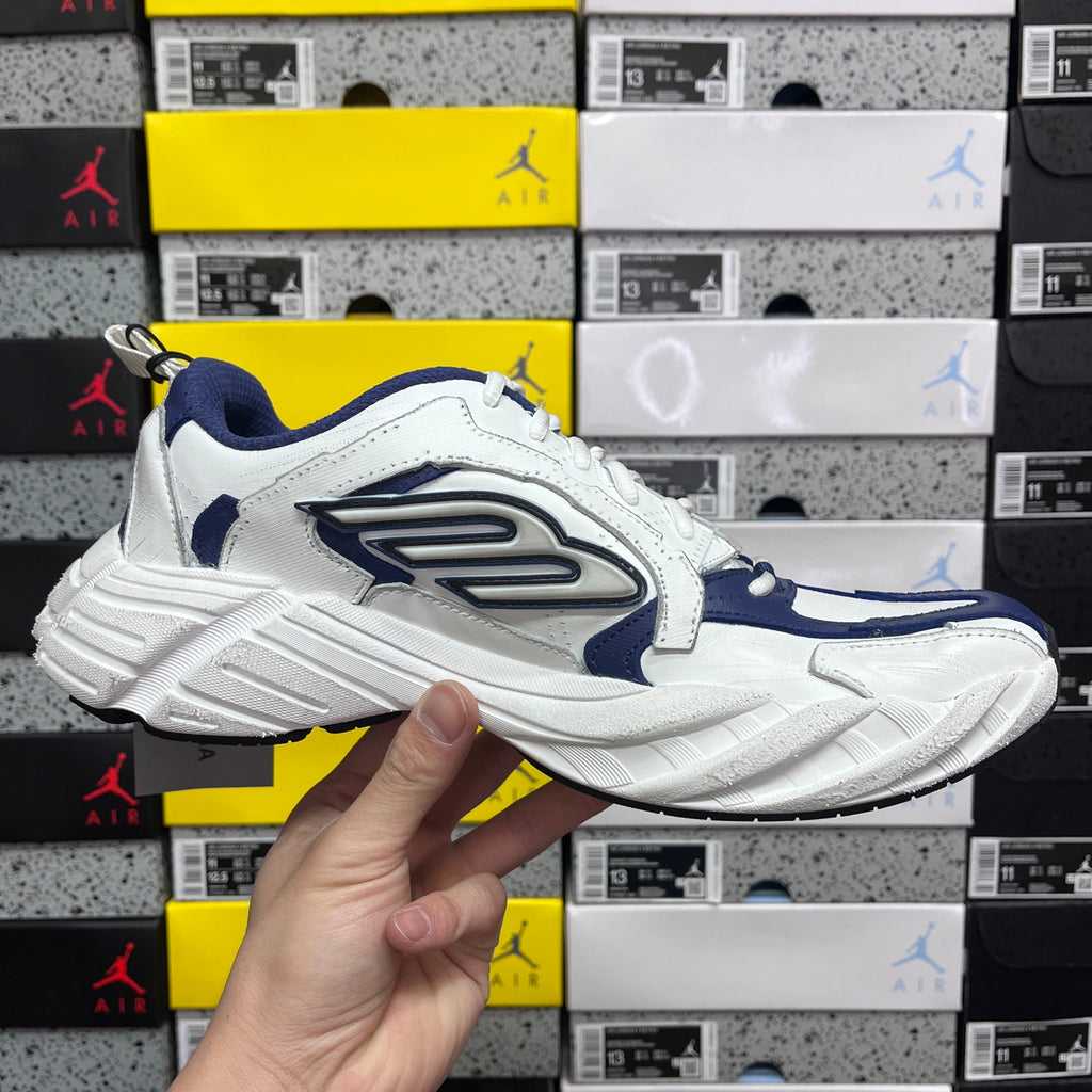 White and blue lace-up sneaker, angled side view, chunky sole