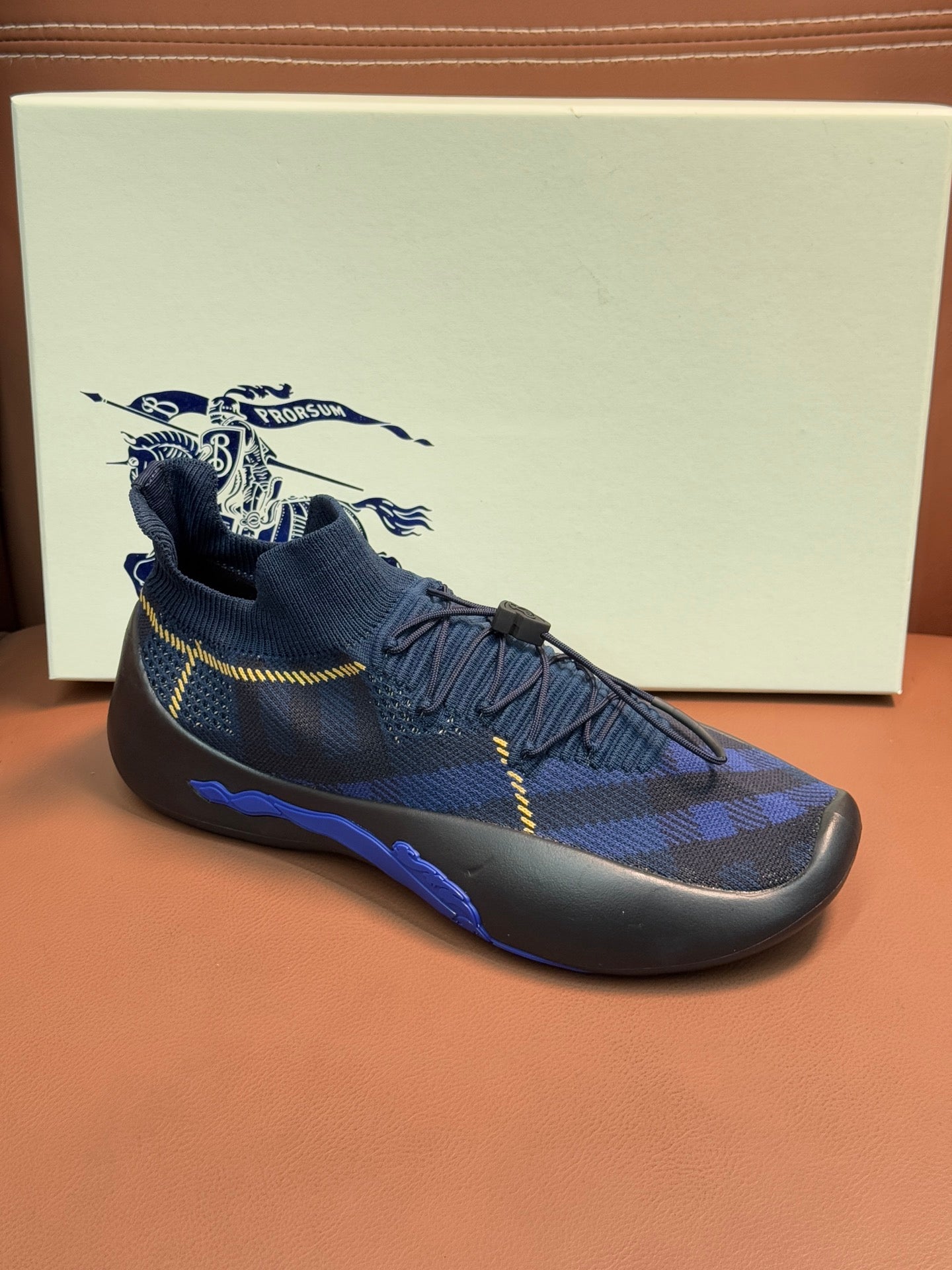 Burberry blue knit sneakers with yellow laces and side strap detail