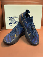 Burberry blue knit sneakers pair with yellow trim and lace-up upper