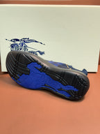 Burberry blue knit sneakers showing treaded outsole and side panel texture
