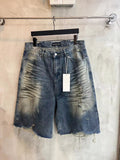 Blue denim shorts with frayed hem, drawstring waist, front button and belt loops