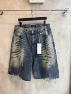 Blue denim shorts with frayed hem, drawstring waist, front button and belt loops