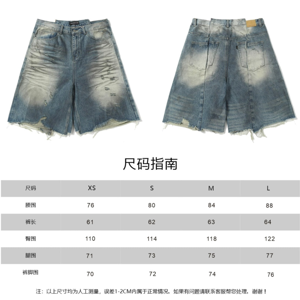 Pair of blue denim shorts with wash pattern and size guide chart below