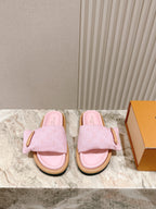 Louis Vuitton pink fabric slide sandals with tan rubber sole and gold-tone buckle
