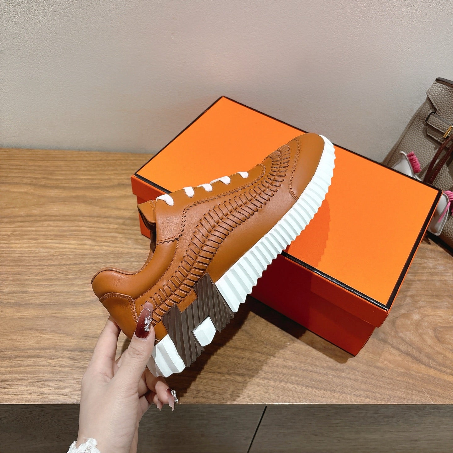 Hermes unisex leather sneaker, tan upper with white laces and ridged white platform sole